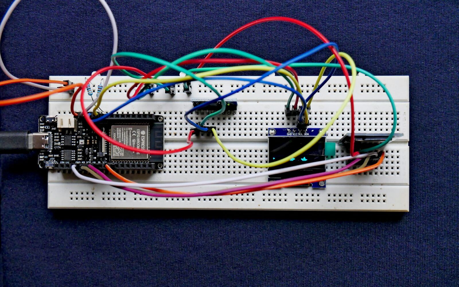 An ESP32 development board wired up on a breadboard
